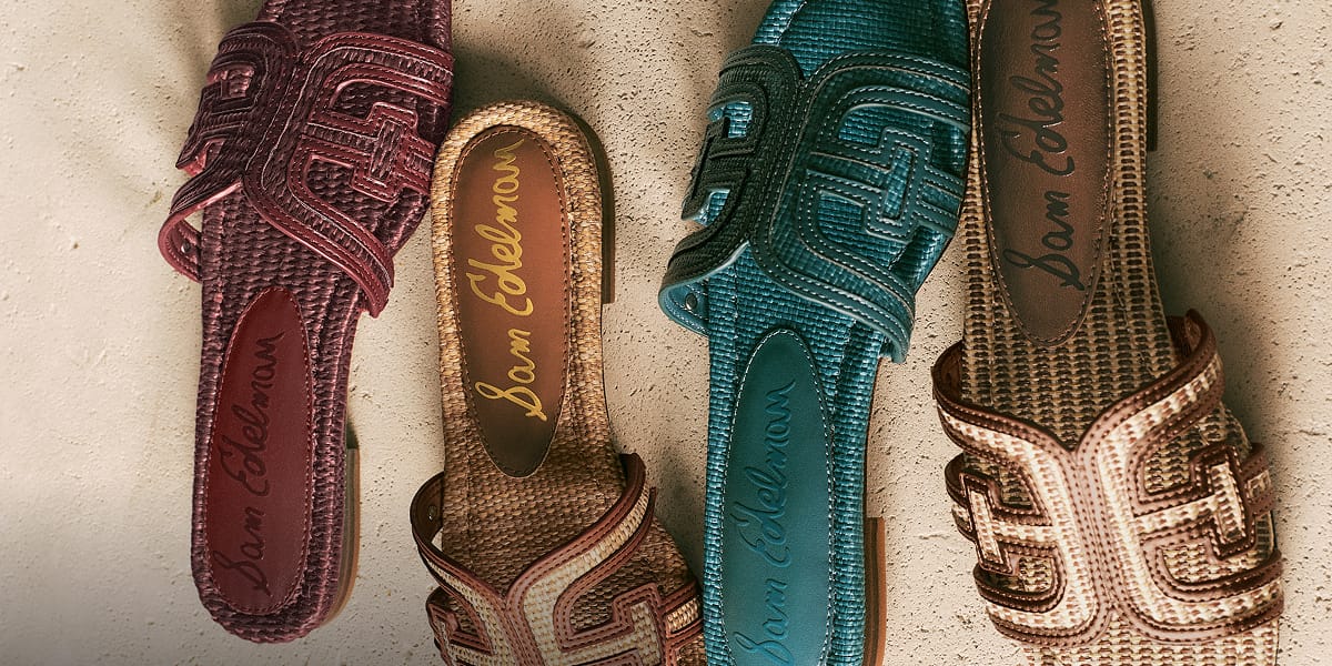 Four Sam Edelman Bay Slide Sandals in Brick Se, Twany Tan, Cafe Sand, and Pacific Teal faux raffia.